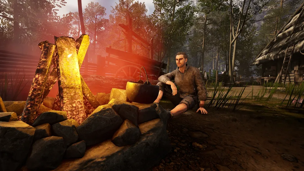 На картинке изображён человек, сидящий у костра на фоне леса и построек.