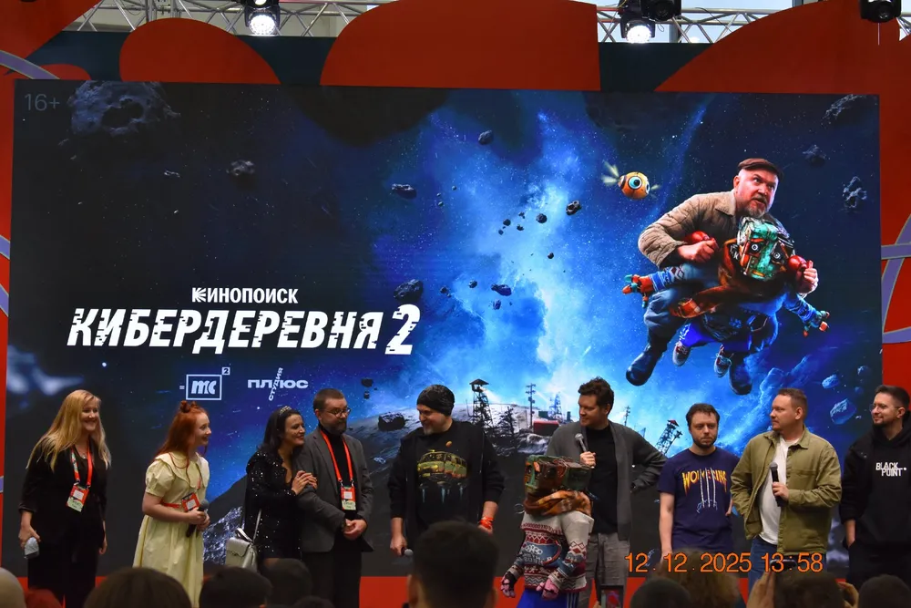 На изображении группа людей на сцене, рекламирующих фильм или мероприятие под названием \